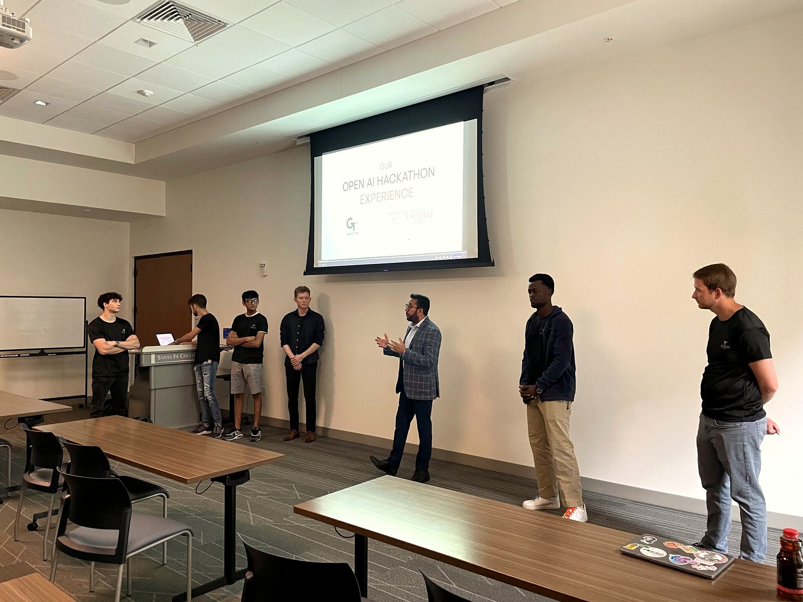 Students presenting at the OpenAI hackathon hosted at ET Labs